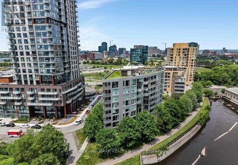 A river runs through a city with buildings on both sides.