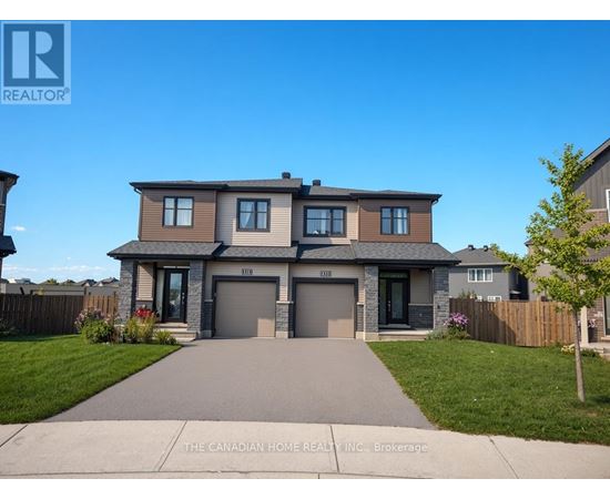 A house with a grey front yard and a driveway.