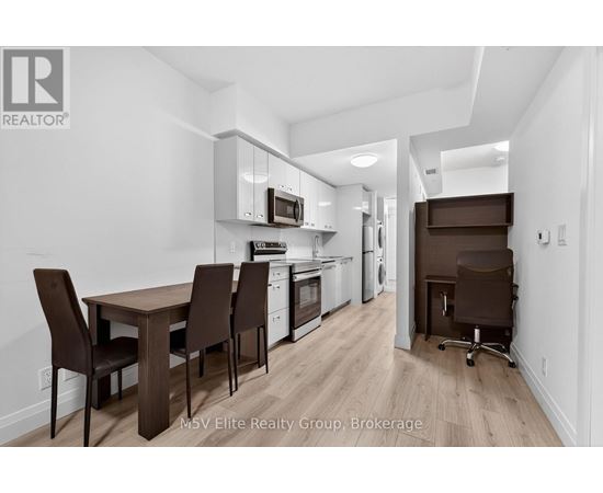 A kitchen with brown chairs and a wooden table.