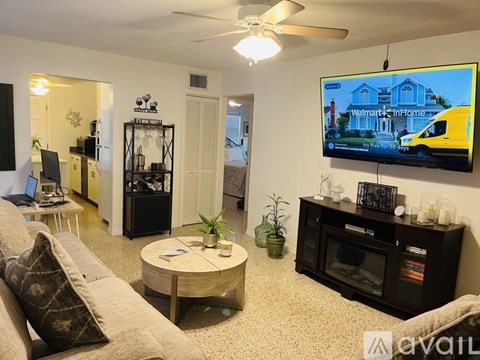 A living room with a Walmart advertisement on the TV.