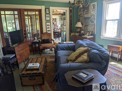 A living room with a grey sofa and a coffee table.