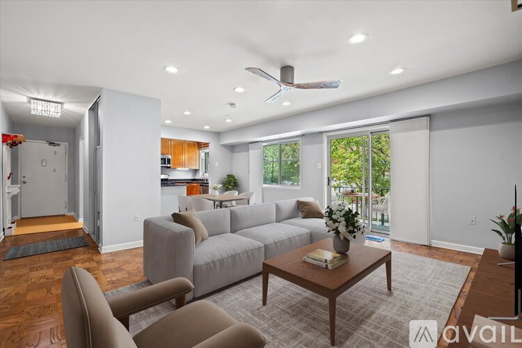 A living room with a grey couch and a coffee table.