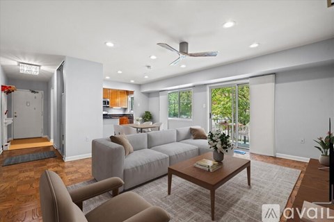 A living room with a grey couch and a coffee table.