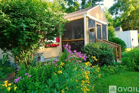 A house with a garden in front of it.