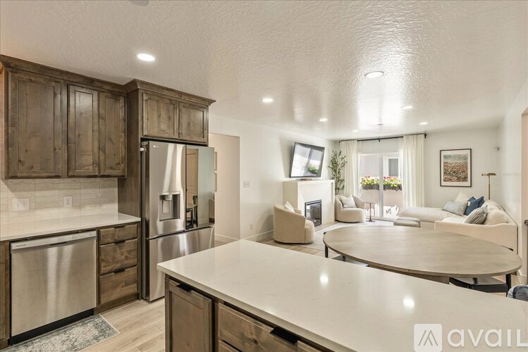A kitchen with wooden cabinets and a white countertop.