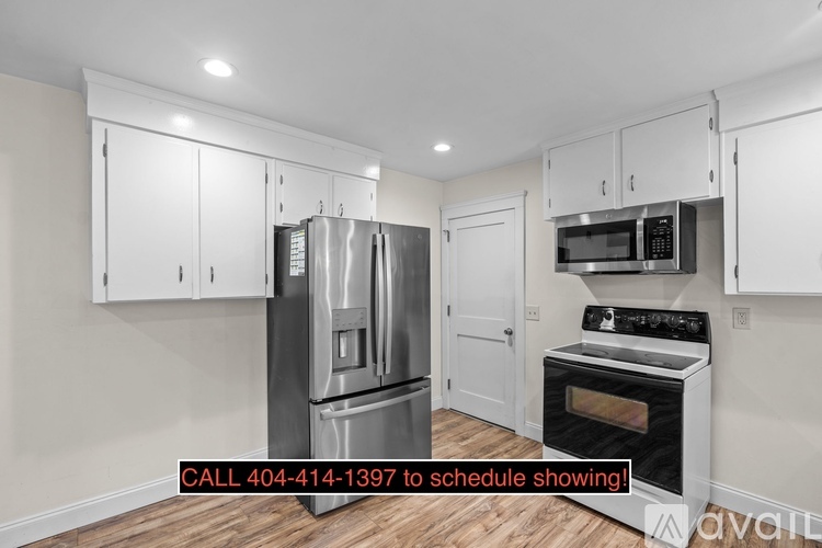 A kitchen with a refrigerator, oven, and microwave is available for viewing.