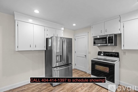A kitchen with a refrigerator, oven, and microwave is available for viewing.