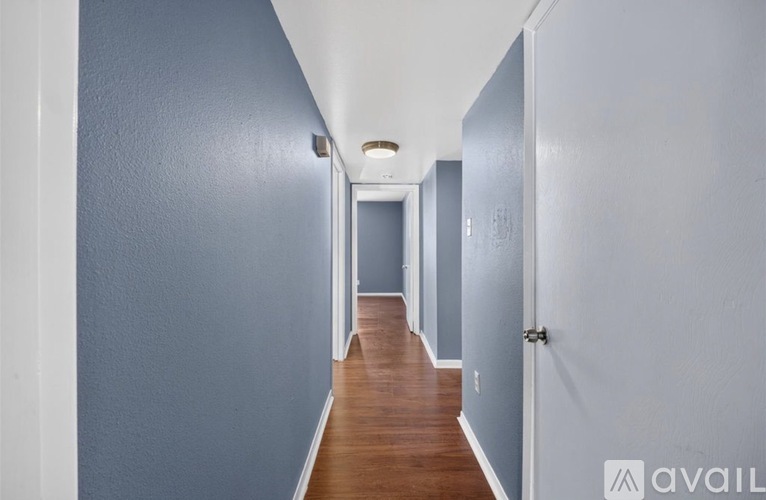 A long hallway with doors on both sides.
