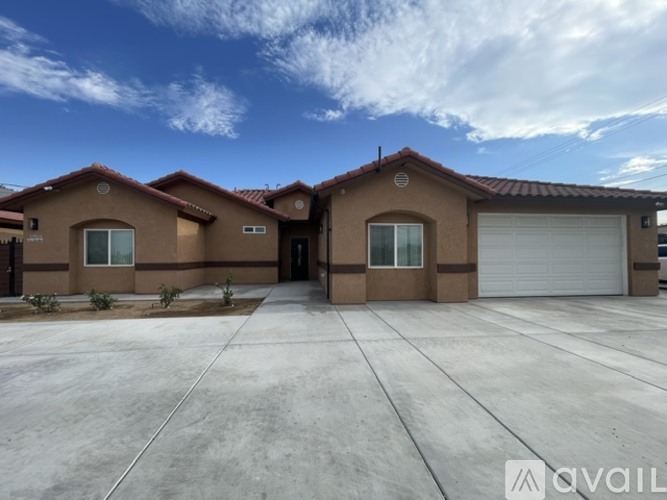 A house with a garage is available for sale.