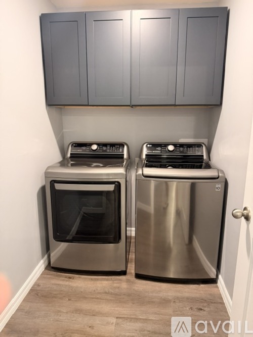 Two stainless steel dishwashers in a kitchen.