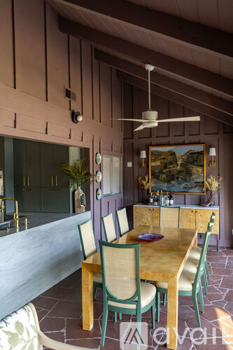 A dining room with a table set for two.