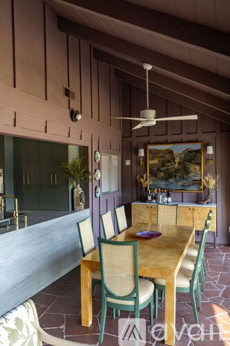 A dining room with a table set for two.