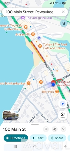 A map application is open, showing a street view of 100 Main Street in Pewaukee.