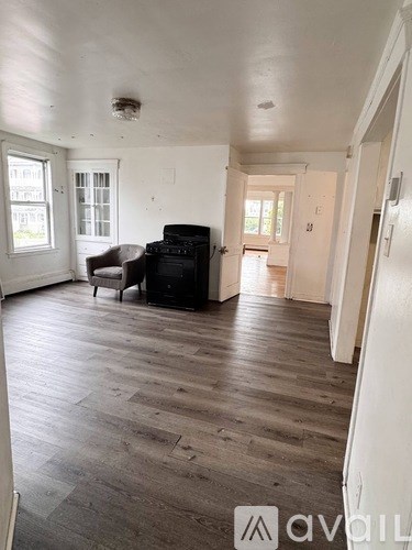 A living room with a couch and a television.