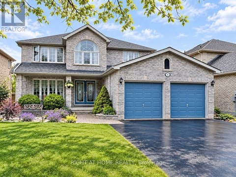 A large house with a blue garage door is for sale.