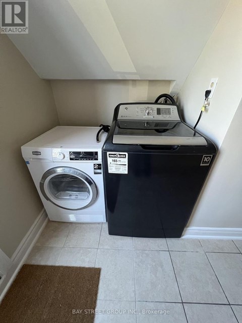 A washer and dryer in a small laundry room.