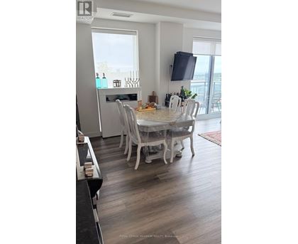 A dining room with a table set for six people.