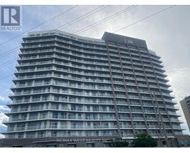 A tall building with the sign LIM on the top.