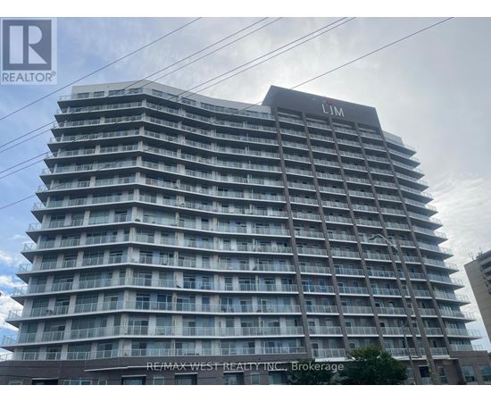 A tall building with the sign LIM on the top.