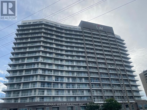A tall building with the sign LIM on the top.