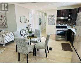 A modern kitchen with a dining table and chairs.