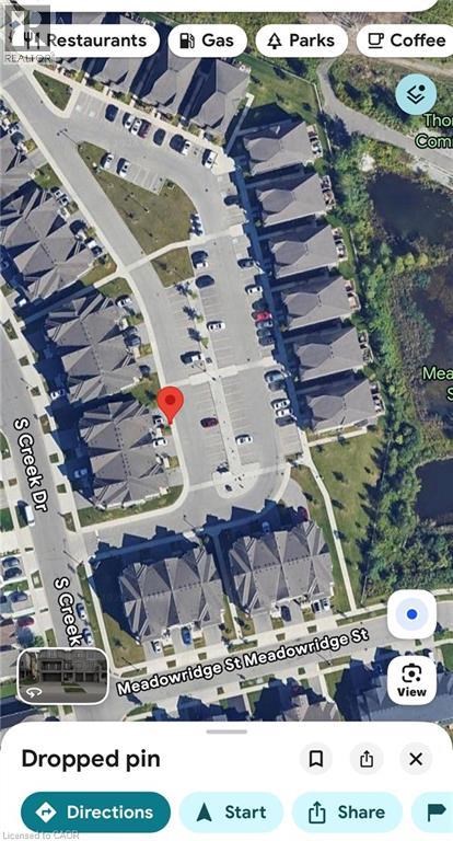 A satellite image of a street view with Thomas Slee Dr and Meadowridge St Swp.