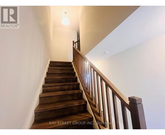 A staircase with wooden steps and a railing.