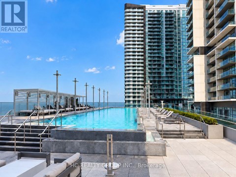 A pool area with a view of a city skyline.