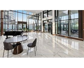 A modern dining area with a piano and a view of the outside.
