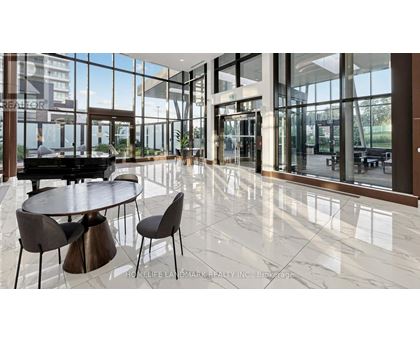 A modern dining area with a piano and a view of the outside.