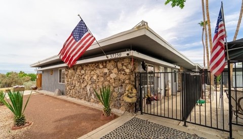 A house with a flag on the front.