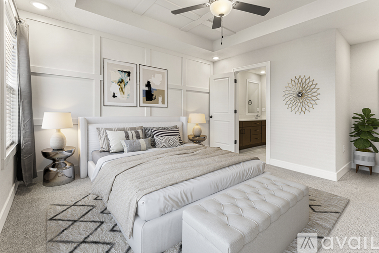 A bedroom with two beds and a ceiling fan.