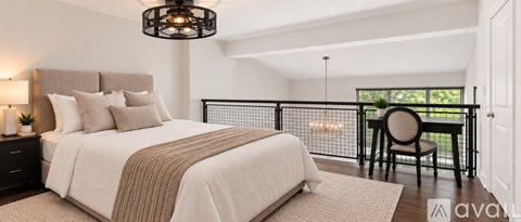 A bedroom with a large bed and a balcony.