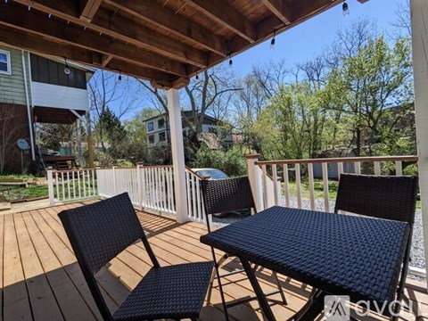 A patio with a table and chairs is shown.