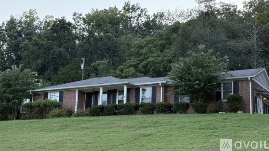 A house with a lawn in front of it.