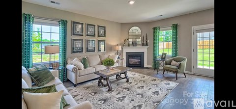A living room with a fireplace and a couch.