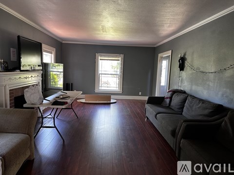 A living room with a fireplace and a couch.