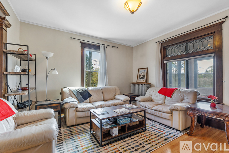 A living room with a white sofa and a coffee table.