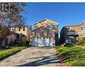 A house with a garage is for sale.