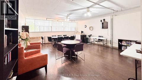 A room with a table and chairs in it.