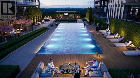 A poolside scene with people relaxing and a realtor logo.