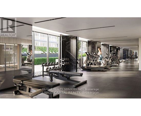 A gym with a variety of equipment including treadmills, weights, and exercise machines.
