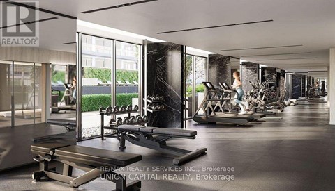 A gym with a variety of equipment including treadmills, weights, and exercise machines.