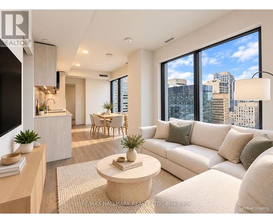 A modern living room with a large window overlooking the city.