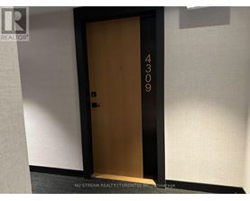 A brown door with the number 4309 on it.