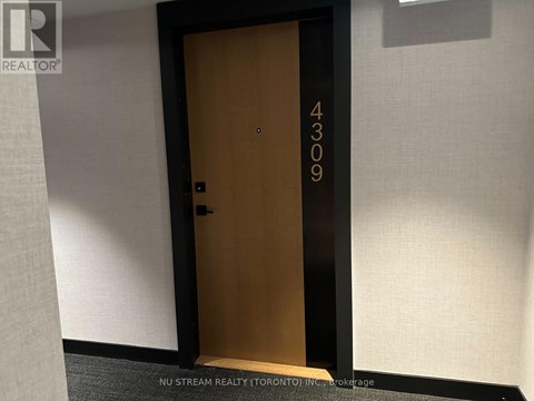 A brown door with the number 4309 on it.