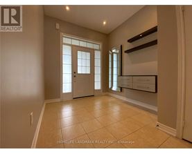 A spacious room with a door and a window.