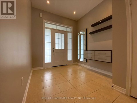 A spacious room with a door and a window.