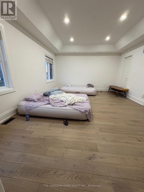 A bedroom with a bed and a bench in it.