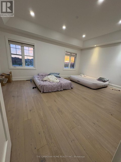 A bedroom with a bed and a sofa in it.